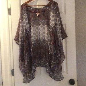 A lightweight wrap with sleeves, never worn